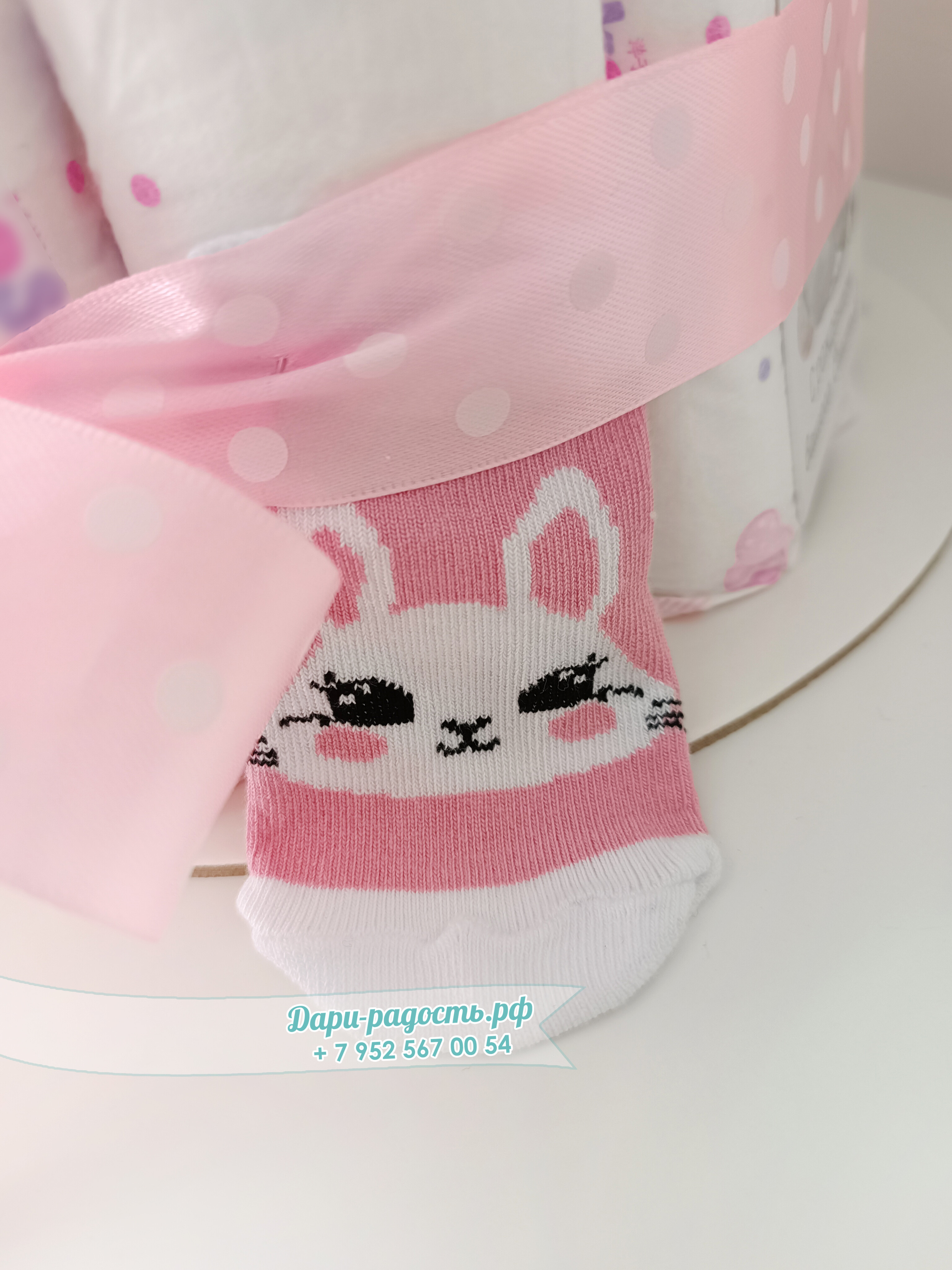 Торт из памперсов "Зайка" с игрушкой и носочками на рождение девочки